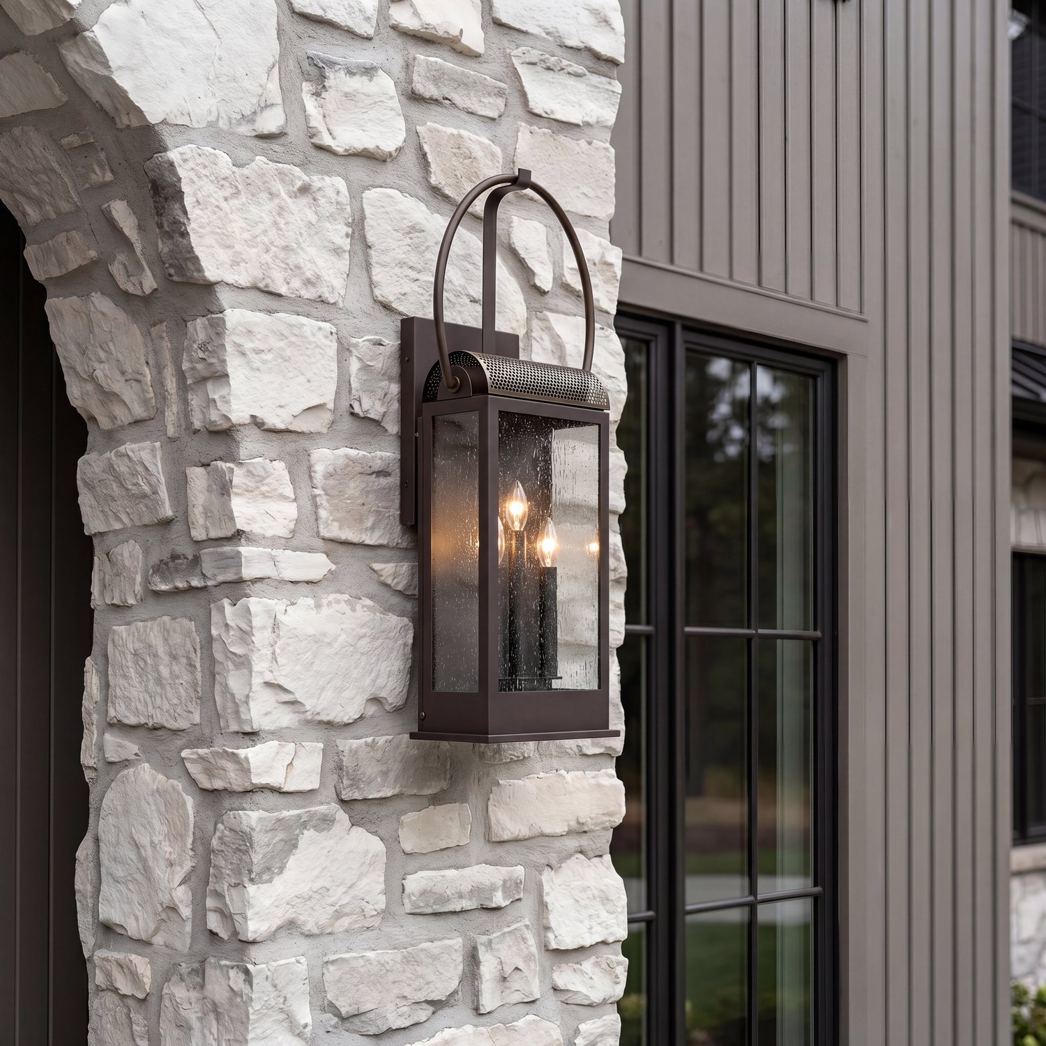 Bronze lantern sconce on stone