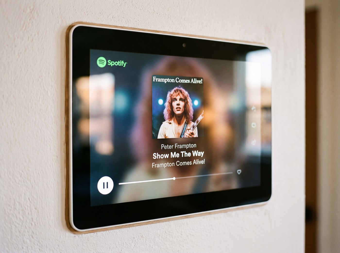 Wall-mounted smart-home control panel playing Spotify