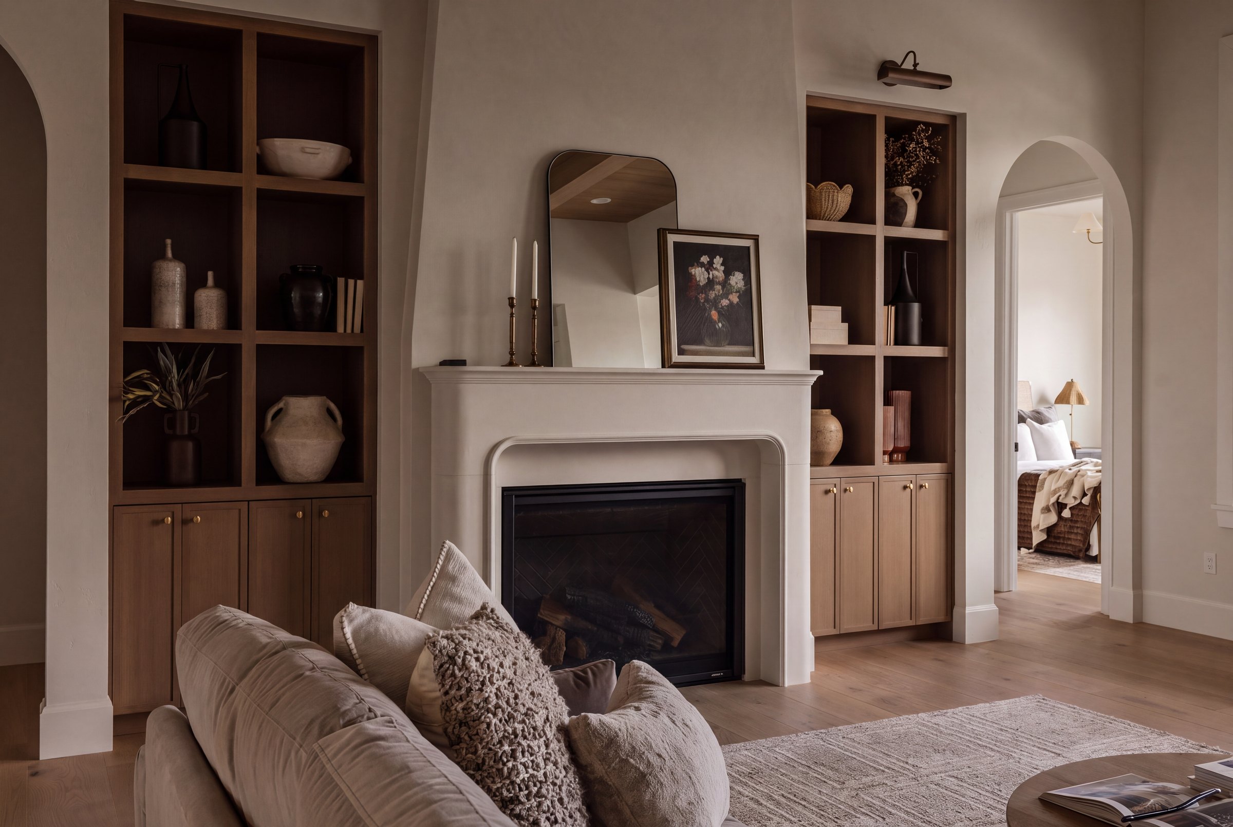 Great room with plaster fireplace and oak built-ins